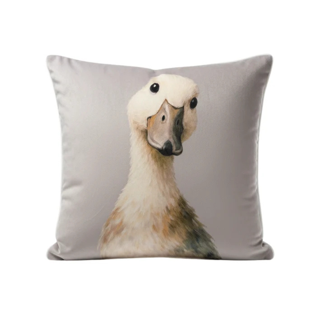Light gray cushion with plush duck face applique and embroidered eyes