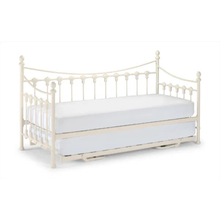 White day bed with spindle headboard and footboard, arched side rails, and a flat mattress