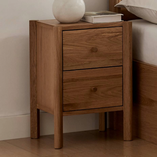 Wooden nightstand with two drawers and rounded knobs, rectangular top.