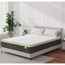 Hermes mattress on bed frame, white top with green border, dark gray cover