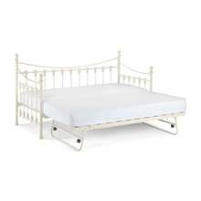 White day bed with pull-out trundle platform extended under the mattress, showing side brackets