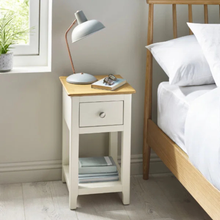 White and oak bedside table with one drawer and lower shelf, round metal knob.