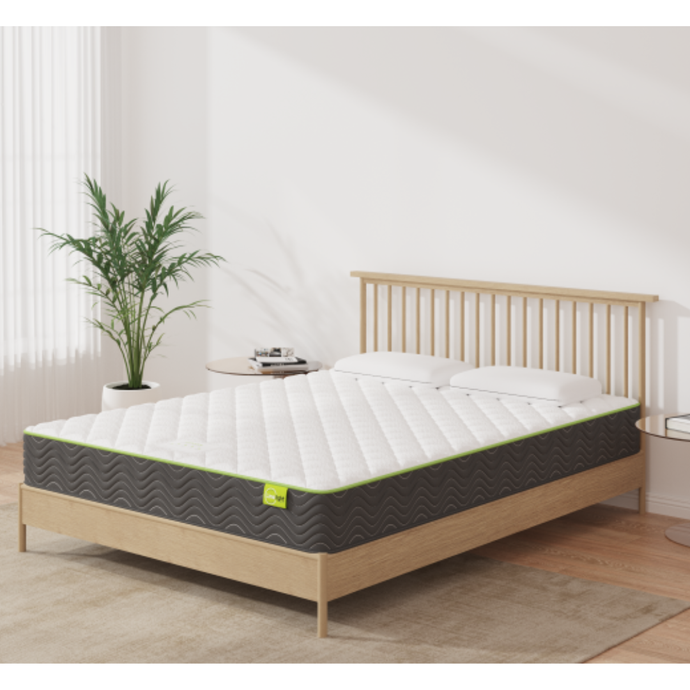 Pocket coil mattress with white quilted top, dark cover, and lime trim on bed frame
