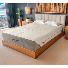 Natural 4000 mattress with quilted cream top and gray side panels, shown on bed frame