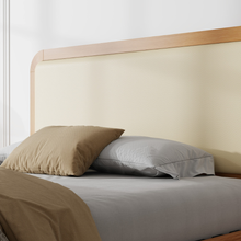 Stanhope wooden ottoman bed, vanilla upholstered headboard close-up