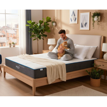 Mlily mattress with quilted white top and blue edge band on frame