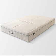 Cream mattress with quilted surface, stitched pattern, and side label