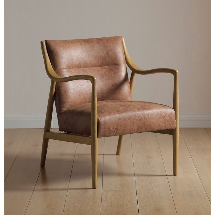 Vintage tan leather armchair with curved arms and square tapered wooden legs