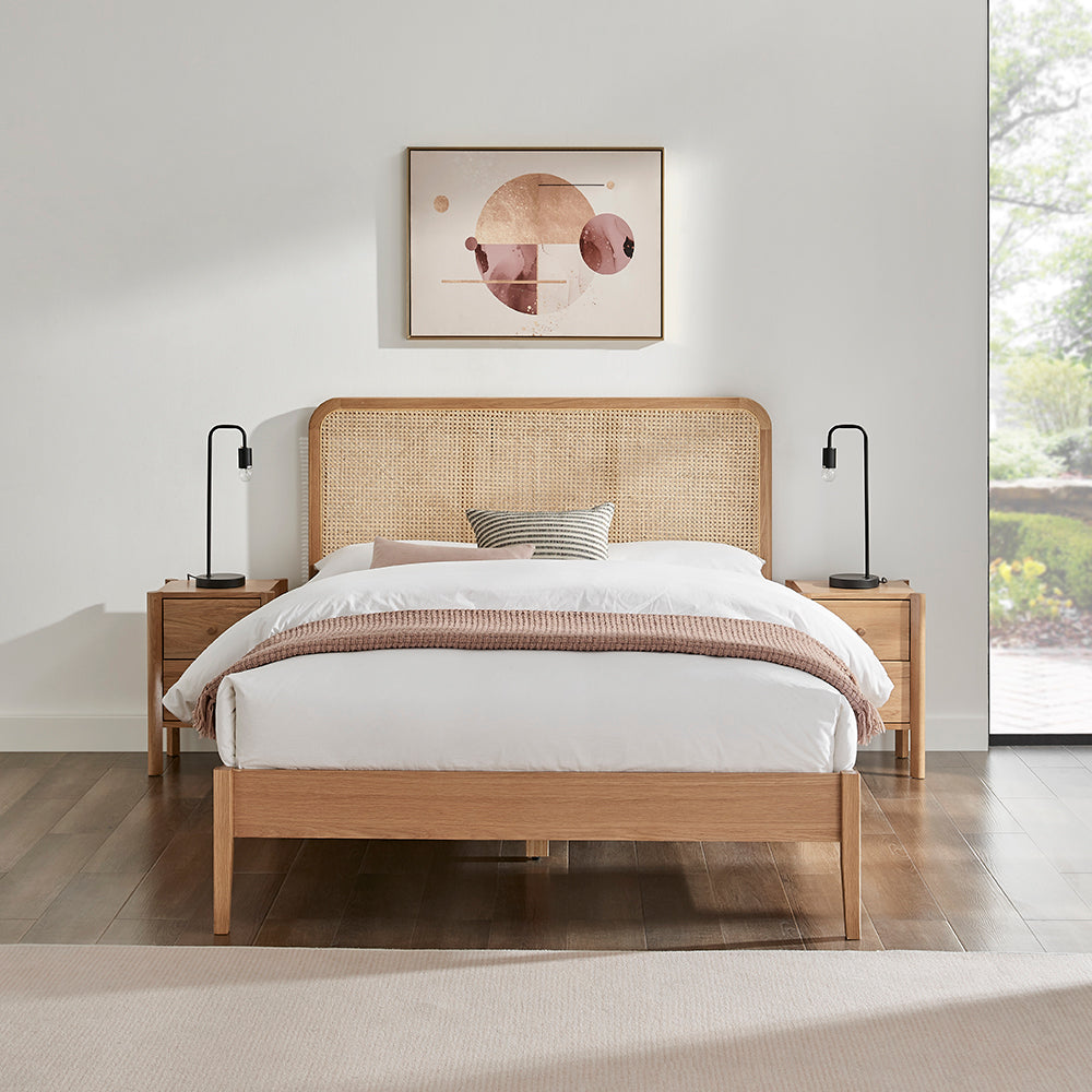 Livia bedframe with woven cane rattan headboard and light wood frame, platform base