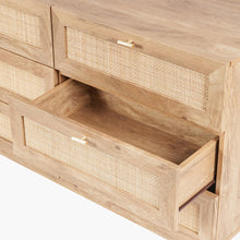 Open drawer on 6-drawer chest, showing woven rattan front and light wood interior
