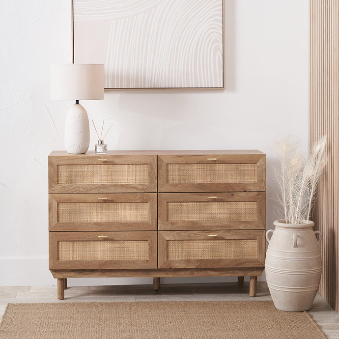 6-drawer chest with woven rattan fronts, light wood frame, and slim metal bar pulls