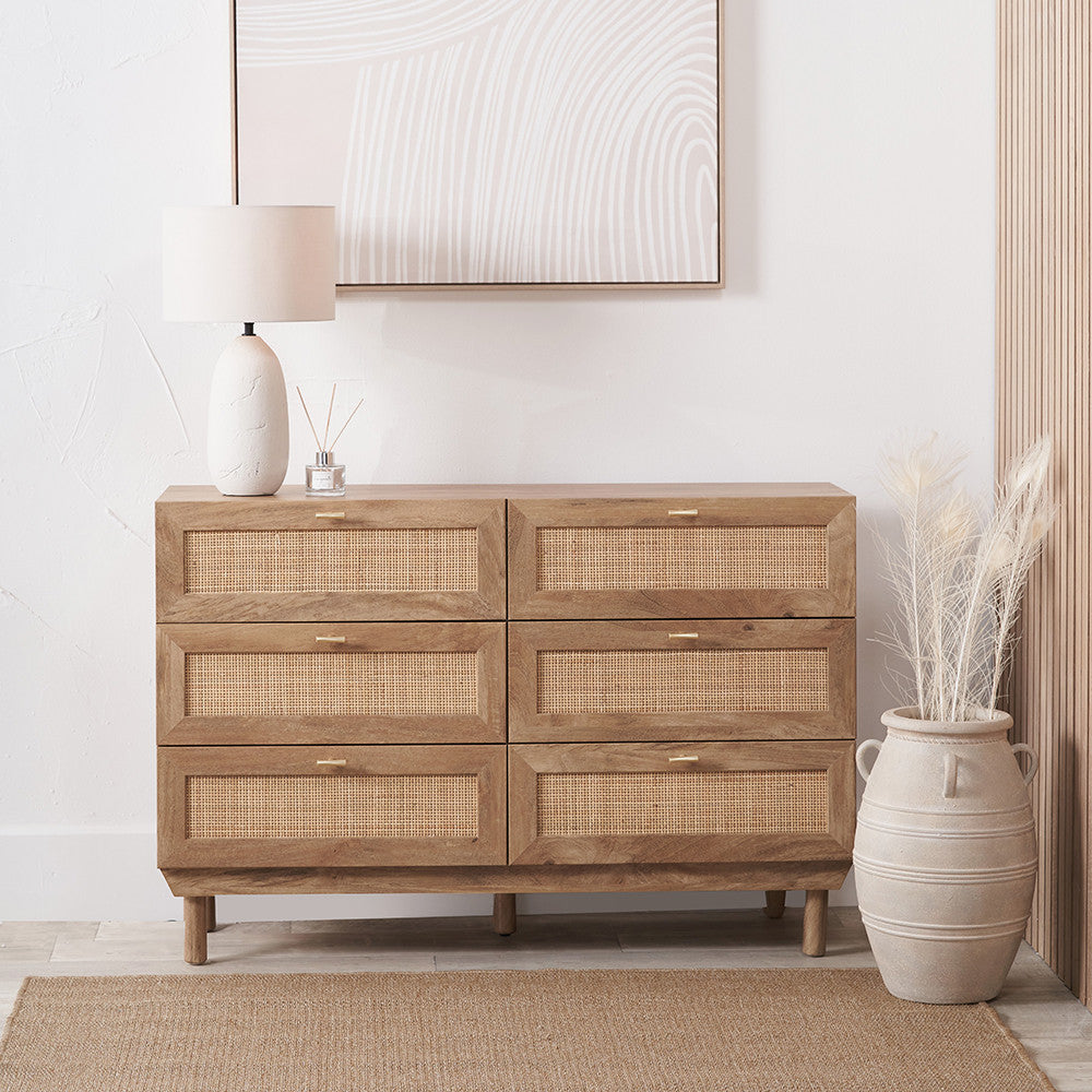 6-drawer chest with woven rattan fronts, light wood frame, and slim metal bar pulls