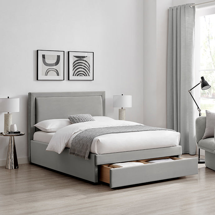 Grey fabric drawer bed with tall headboard and white bedding set, bedroom angle view