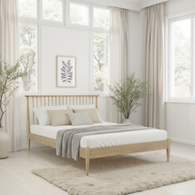 Light oak bedstead with tall slatted headboard and matching footboard, sturdy legs