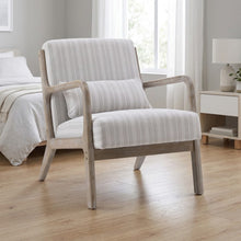 Washed finish wooden armchair with light striped upholstery, cushioned seat and back.