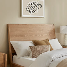 Rosalie bedframe close-up with light wood headboard and slatted support base