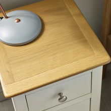 Oak-effect tabletop with white drawer and round silver knob, 3-drawer bedside table