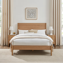 Wooden bedframe with low headboard, rounded corner posts, and slatted base; front view