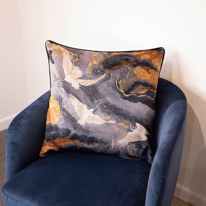 Grey square cushion with gold and white crane and cloud pattern