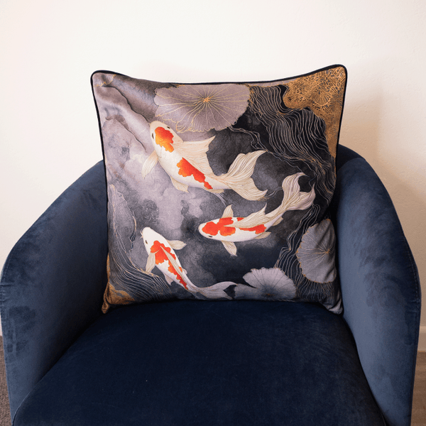 Square grey cushion with koi fish and floral pattern, dark backing