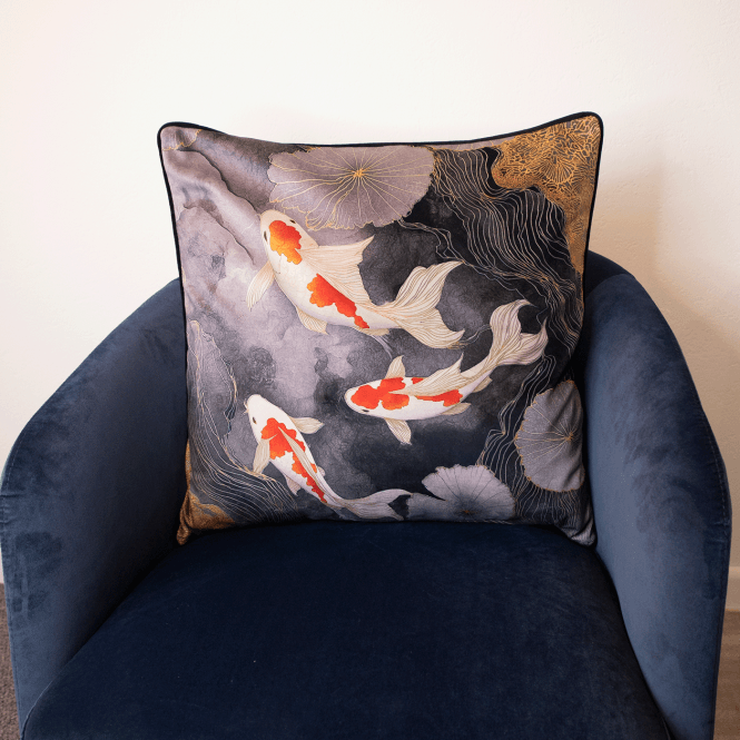Square grey cushion with koi fish and floral pattern, dark backing
