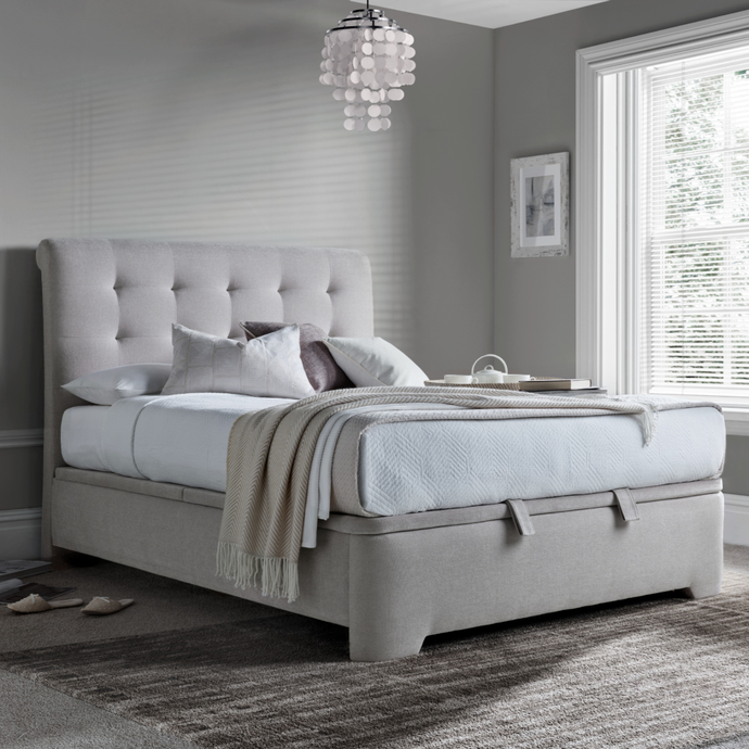 Hatton ottoman bed, upholstered in light gray fabric with tufted headboard