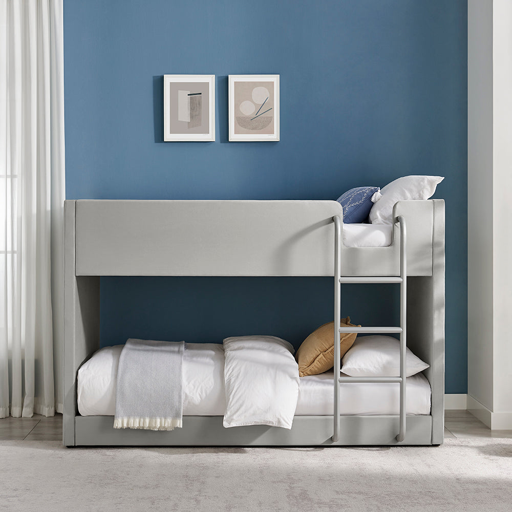 Meadow bunk bed with light gray upholstered frame, headboard, and built-in ladder.