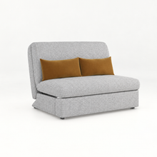Light gray sofa bed with two tan throw pillows and rounded track arms