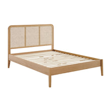 Livia bedframe with slatted wood base and woven rattan panel headboard, tapered legs