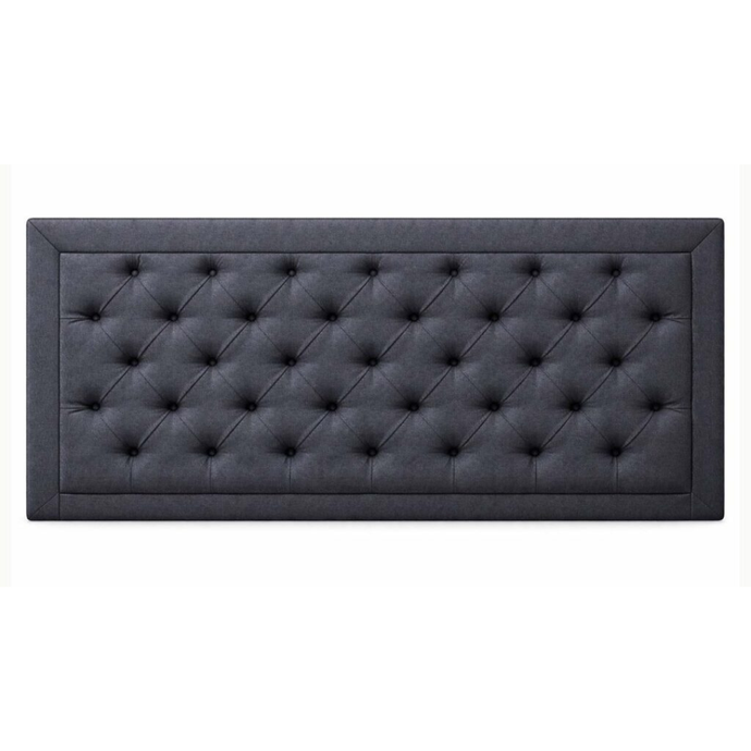 Upholstered tufted headboard in dark gray with buttoned diamond pattern