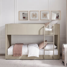 Meadow bunk bed with tufted light gray end panels, ladder, and upholstered headboard.
