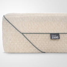 Haulna Natural 2500 mattress side, cream textured quilting with Natural 2500 label.