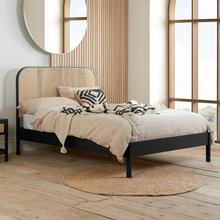 The Reine Rattan bedstead in Black Oak