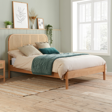 The Reine Rattan bedstead in Oak